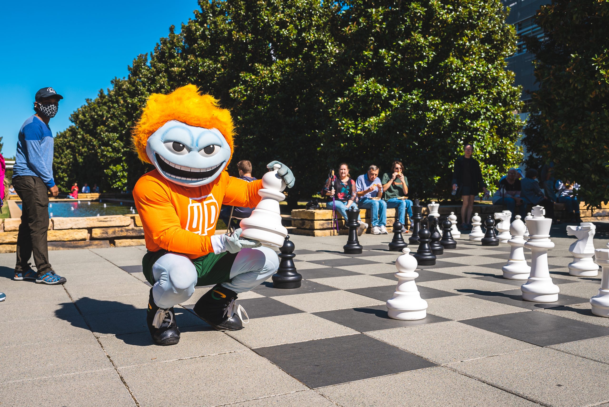 Temoc, the Official Mascot of UT Dallas, playing Chess on campus.